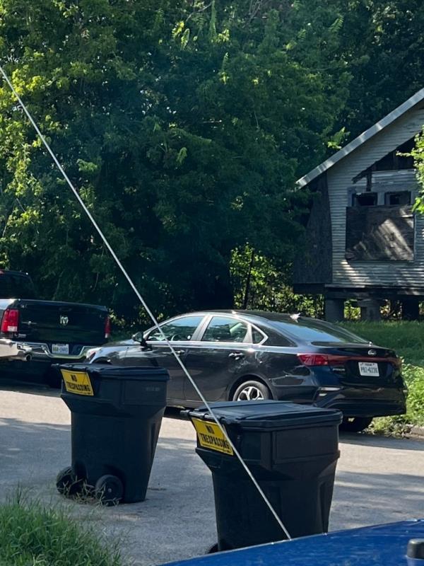 Santana's rental car parked outside of the house.