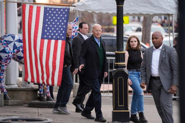 President Joe Biden walks with Lauren Vargas, Co-Owner, President of Nowher<em></em>e Coffee Co., during a visit to discuss his eco<em></em>nomic agenda, Friday, Jan. 12, 2024, in Emmaus, Pa.