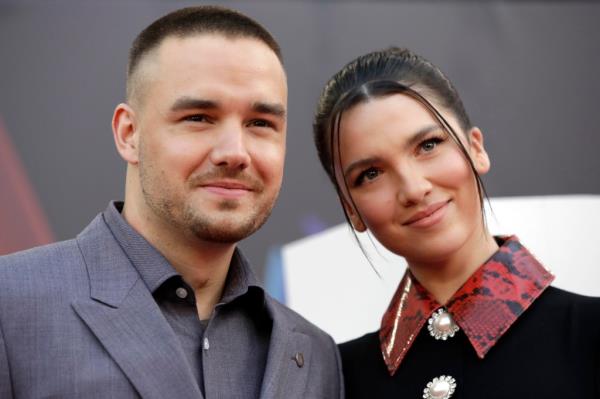 Payne and Henry attend the premiere of 