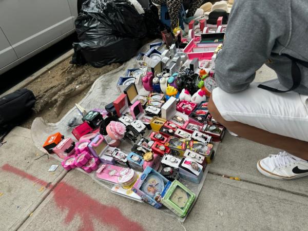 Goods for sale on the sidewalk. 