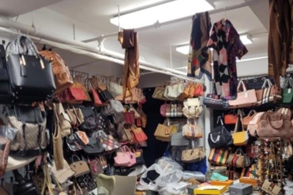 Photos released by the US Attorney’s Office showed units filled to the brim with thousands of counterfeit high-end handbags of every color and design. Some clothes were hanging off the pipes in one room.