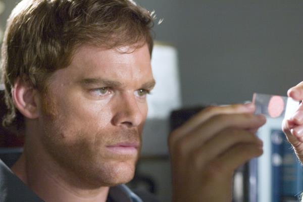 Michael C Hall looking closely at evidence on 