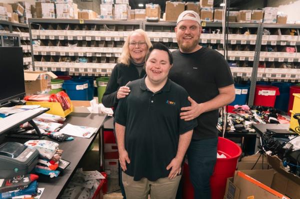 John Cro<em></em>nin is seen in his company warehouse with his mother Carol and older brother Jamie, who help run the business.