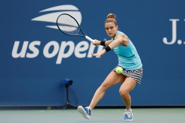 Maria Sakkari gets ready to hit a tennis ball.