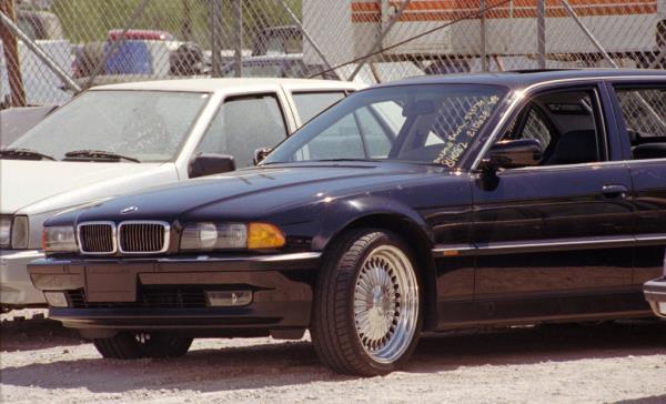 FILE - In this Sept. 8, 1996, file photo, a black BMW, riddled with bullet holes, is seen in a Las Vegas police impound lot. Rapper Tupac Shakur was shot while riding in the car driven by Death Row Records chairman Suge Knight on Sept. 7, 1996, and died six days later. The car was listed for sale for $1.5 million on Feb. 21, 2017, by a California memorabilia dealer. (AP Photo/Lennox McLendon, File)