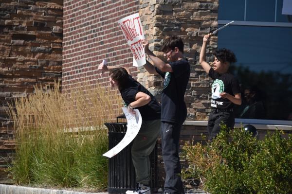 Starbucks workers walk off the job holding placards to support the strike at the Starbucks Coffee shop in Ledgewood, NJ on Sep. 1, 2023. 