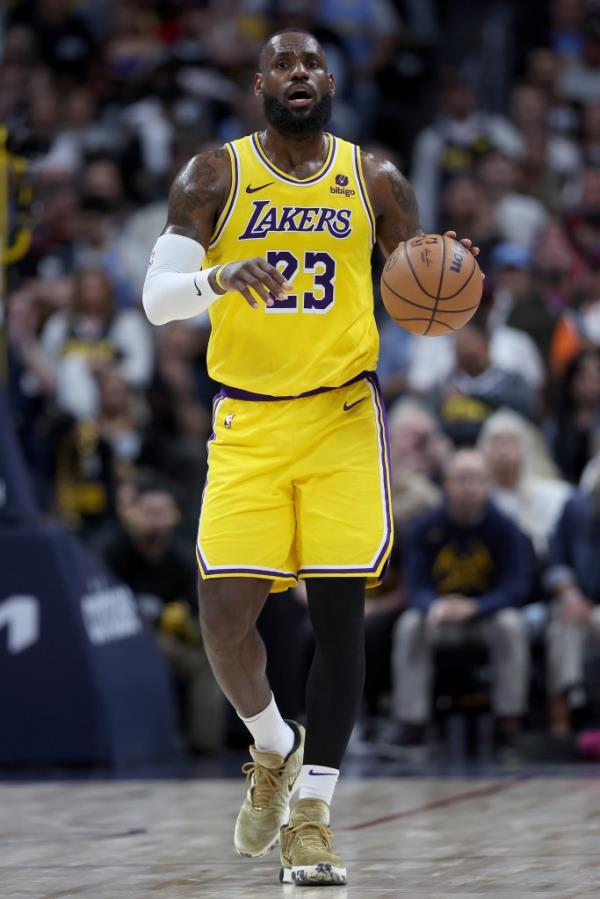 LeBron James #23 of the Los Angeles Lakers dribbling the basketball down the court against the Denver Nuggets during the third quarter of the Western Co<em></em>nference First Round Playoffs