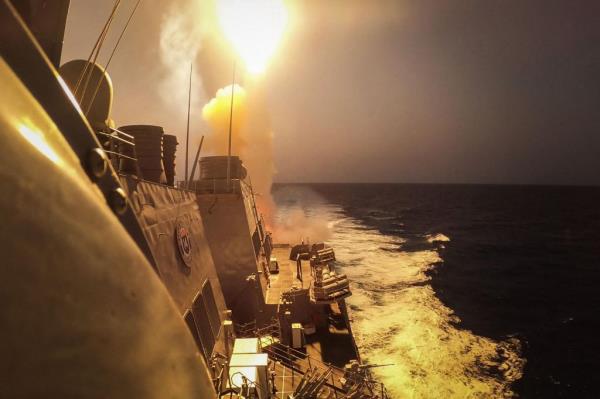 A United States Navy ship intercepting missiles and dro<em></em>nes launched by the Houthis in the Red Sea in October.