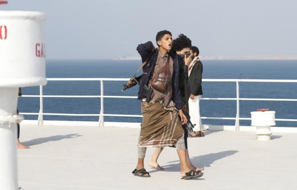 An armed Houthi rebel o<em></em>nboard the cargo ship Galaxy Leader, which was seized by the Houthi extremist group in November.