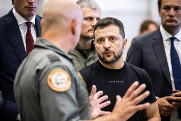 Mandatory Credit: Photo by Hollandse Hoogte/Shutterstock (14060743e) EINDHOVEN - Ukrainian President Volodymyr Zelensky looks at the F16s in a hangar during a visit to Eindhoven Air ba<em></em>se. The Netherlands will supply F-16 fighter jets to Ukraine together with Denmark. President Zelensky of Ukraine for a Lightning Visit to the Netherlands, Eindhoven - 20 Aug 2023