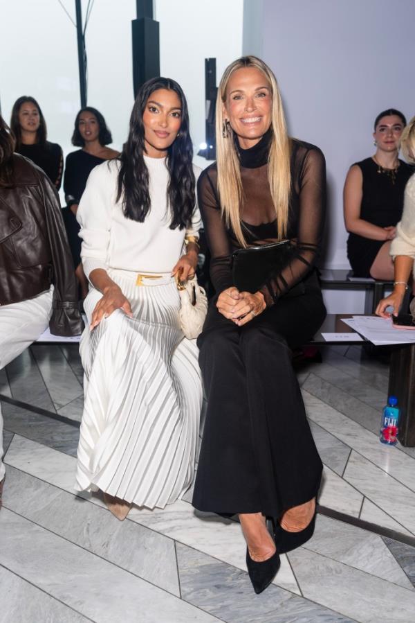 Pritika Swarup and Molly Sims sitting on a bench at the Jo<em></em>nathan Simkhai fashion show during the September 2024 New York Fashion Week