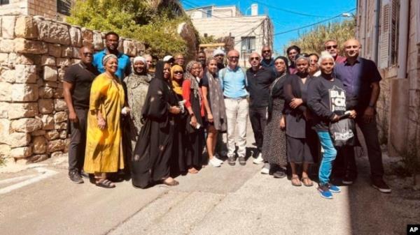 FILE - In this photo provided by Black Jerusalem, members of the “Black Jerusalem” trip pose for a photograph in the Ein Karem neighborhood of Jerusalem, on Sept. 29, 2023.