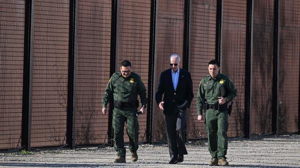 Biden walking with border officials
